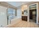 Main bathroom features a separate tub, a glass shower, and custom cabinets at 10332 Sweet Laurel St, Las Vegas, NV 89178