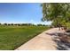 Expansive green space at Mountain's Edge community with walking path and shade trees at 10332 Sweet Laurel St, Las Vegas, NV 89178