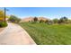 Scenic walking path at Mountain's Edge with grassy areas and native desert landscape at 10332 Sweet Laurel St, Las Vegas, NV 89178