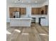 Modern kitchen featuring a sleek white island, stainless steel appliances and contemporary style wood cabinets at 10405 Junction Hill Dr, Las Vegas, NV 89134