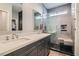 Modern bathroom with a double sink vanity, glass-enclosed shower, and contemporary finishes at 1045 Chestnut Chase St, Las Vegas, NV 89138