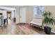 Bright entryway featuring wood floors, plantation shutters, and a contemporary bench at 1045 Chestnut Chase St, Las Vegas, NV 89138