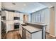 Bright kitchen with stainless steel appliances, a center island, and a view of the backyard at 1045 Chestnut Chase St, Las Vegas, NV 89138