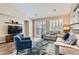 Comfortable living room with stylish furnishings, a modern rug, and lots of natural light at 1045 Chestnut Chase St, Las Vegas, NV 89138