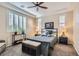 Comfortable main bedroom with a ceiling fan, shutters, and a gray color scheme at 1045 Chestnut Chase St, Las Vegas, NV 89138