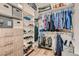 Organized walk-in closet featuring custom shelving, hanging rods, and storage for clothing and accessories at 1045 Chestnut Chase St, Las Vegas, NV 89138