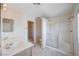 Bathroom showcasing double sinks and a shower with sliding glass doors at 10505 Cold Mountain Ave, Las Vegas, NV 89129