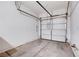 Spacious garage interior with a white door at 10505 Cold Mountain Ave, Las Vegas, NV 89129