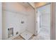 Bright laundry room features utility connections and built-in shelving at 10505 Cold Mountain Ave, Las Vegas, NV 89129