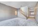 Large living room with gray walls, stairs and large windows awaiting renovation at 10505 Cold Mountain Ave, Las Vegas, NV 89129
