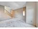 Large living room with gray walls, stairs and large windows awaiting renovation at 10505 Cold Mountain Ave, Las Vegas, NV 89129