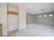Open living room with adjacent kitchen area provides natural light and plenty of space for custom renovation at 10505 Cold Mountain Ave, Las Vegas, NV 89129