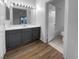 Bathroom featuring double vanity and access to a shower over tub at 10524 India Hawthorn Ave, Las Vegas, NV 89144