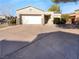 Single-story home featuring a two-car garage and neutral color scheme at 10524 India Hawthorn Ave, Las Vegas, NV 89144