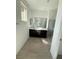 Bathroom featuring a double sink vanity, tile flooring, and glass enclosed shower at 11443 Ethereal Landing Ave, Las Vegas, NV 89138