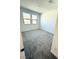 Bright bedroom with two windows and carpeted flooring at 11443 Ethereal Landing Ave, Las Vegas, NV 89138