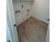Laundry room featuring tile flooring and washer-dryer hookups at 11443 Ethereal Landing Ave, Las Vegas, NV 89138