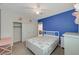 Bright bedroom featuring a ceiling fan, closet, and a vibrant blue accent wall at 11572 Salt Creek Ave, Las Vegas, NV 89138