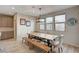 Stylish dining area with a modern wood table and bench seating, with neutral paint at 11572 Salt Creek Ave, Las Vegas, NV 89138