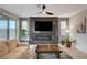 Modern living room showcasing a decorative fireplace and a cozy seating area at 11572 Salt Creek Ave, Las Vegas, NV 89138