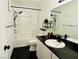 Bathroom with black granite countertops and shower-tub combo at 1405 Vegas Valley Dr # 357, Las Vegas, NV 89169