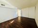Bedroom featuring hardwood floors and a spacious closet with sliding doors at 1405 Vegas Valley Dr # 357, Las Vegas, NV 89169