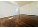Bedroom featuring hardwood floors and a spacious closet with sliding doors at 1405 Vegas Valley Dr # 357, Las Vegas, NV 89169