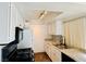 Efficient kitchen featuring white cabinets, granite counters, wood floors and modern appliances at 1405 Vegas Valley Dr # 357, Las Vegas, NV 89169