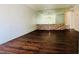 Inviting living room with brick accent wall and warm-toned wood flooring at 1405 Vegas Valley Dr # 357, Las Vegas, NV 89169