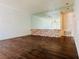 Spacious living room with hardwood floors and a mirrored accent wall at 1405 Vegas Valley Dr # 357, Las Vegas, NV 89169