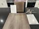 New kitchen design layout features cabinet, flooring, countertop and paint samples with stainless appliances at 1513 Bat Hawk St, Las Vegas, NV 89144