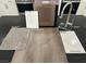 Kitchen design layout displays cabinet, flooring, countertop, carpet, and paint samples with stainless appliances at 1513 Bat Hawk St, Las Vegas, NV 89144