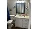 Cozy bathroom with white vanity, framed mirror, and butterfly decor at 1640 E Kearney St, Pahrump, NV 89048