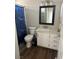 Cozy bathroom features modern vanity, toilet, and shower with a themed curtain at 1640 E Kearney St, Pahrump, NV 89048