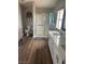 Bright bathroom with a modern vanity, shower with glass doors and neutral accents at 1640 E Kearney St, Pahrump, NV 89048