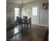 Cozy dining room featuring neutral walls, wood flooring, and stylish furnishings at 1640 E Kearney St, Pahrump, NV 89048