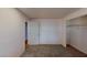 A cozy bedroom with neutral carpet, a built-in closet, and a bright, airy feel at 173 Betty Ln, Las Vegas, NV 89110