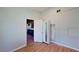 Bright bedroom with hardwood floors, closet and connecting door to the kitchen at 173 Betty Ln, Las Vegas, NV 89110
