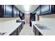 Long kitchen with white counters and black cabinets at 173 Betty Ln, Las Vegas, NV 89110