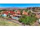 Luxury home showcasing desert landscaping, a terracotta roof, and a pool with beautiful mountain and city views at 2 Camino Barcelona Pl, Henderson, NV 89011