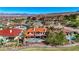Luxury home featuring a terracotta roof, pool, desert landscaping, and beautiful mountain and city views at 2 Camino Barcelona Pl, Henderson, NV 89011