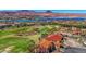 Desirable golf course home with a red tile roof offering breathtaking views of the lake and surrounding mountains at 2 Camino Barcelona Pl, Henderson, NV 89011