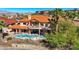 Elegant home with a private backyard oasis featuring a stunning pool, covered patio, and lush landscaping at 2 Camino Barcelona Pl, Henderson, NV 89011