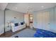 Inviting bedroom with a ceiling fan, a cozy couch, wood floors, and sliding closet doors at 2 Camino Barcelona Pl, Henderson, NV 89011