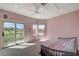 Bright bedroom with balcony access, mountain views, and carpet flooring at 2 Camino Barcelona Pl, Henderson, NV 89011