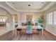 Elegant dining room with modern lighting, stylish decor, and an open view to the kitchen, ideal for gatherings at 2 Camino Barcelona Pl, Henderson, NV 89011