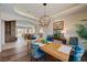 Open dining area flows seamlessly into the living spaces, featuring modern lighting and comfortable seating at 2 Camino Barcelona Pl, Henderson, NV 89011