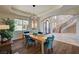 Elegant dining room with a modern chandelier and a view of the outdoors at 2 Camino Barcelona Pl, Henderson, NV 89011
