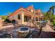 Spacious backyard with a fire pit, and multiple seating areas ideal for outdoor gatherings at 2 Camino Barcelona Pl, Henderson, NV 89011