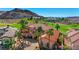 Charming Mediterranean-style home boasting a red tile roof, well-manicured landscaping, and a circular driveway in a scenic location at 2 Camino Barcelona Pl, Henderson, NV 89011
